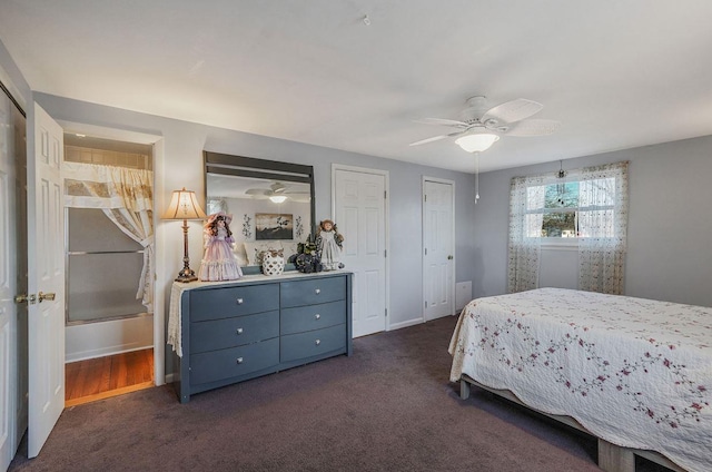 bedroom with multiple closets, ceiling fan, and dark carpet