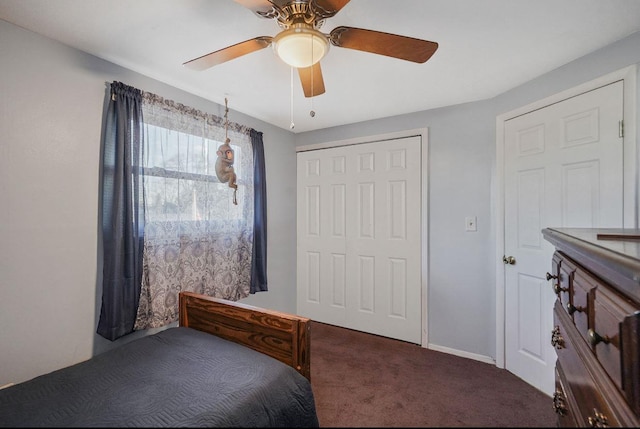 carpeted bedroom featuring a closet and ceiling fan