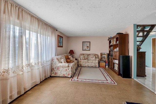 living room featuring a textured ceiling