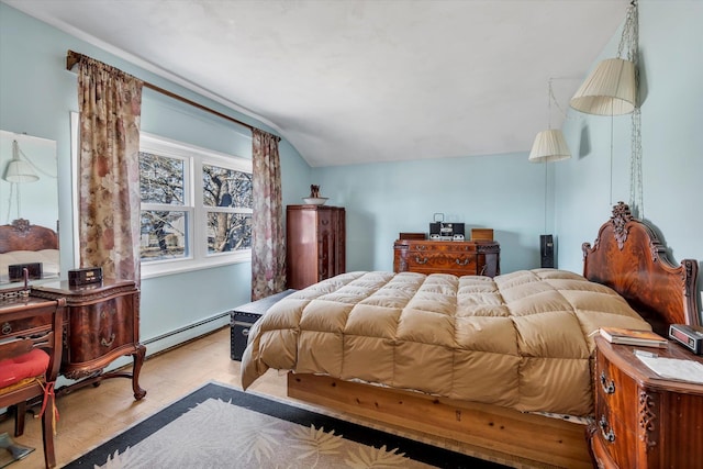 bedroom with a baseboard radiator, vaulted ceiling, and light hardwood / wood-style flooring