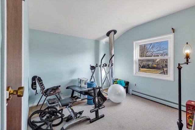 exercise area featuring a baseboard radiator, carpet floors, and vaulted ceiling