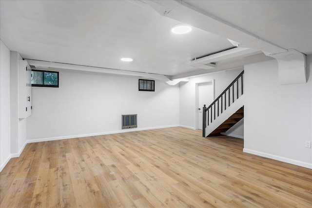 basement featuring light hardwood / wood-style floors