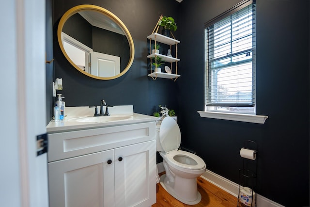 bathroom featuring hardwood / wood-style flooring, vanity, and toilet