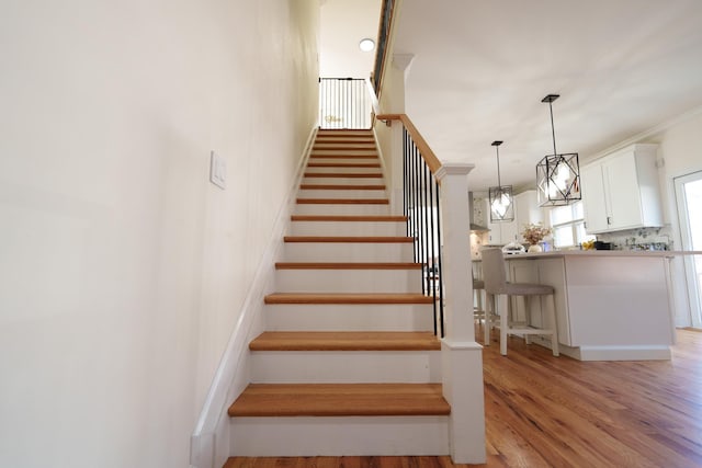 staircase featuring hardwood / wood-style floors