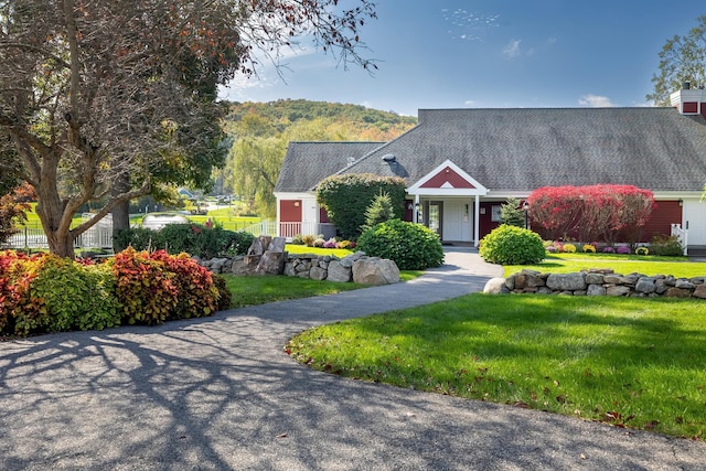 view of front of property with a front lawn