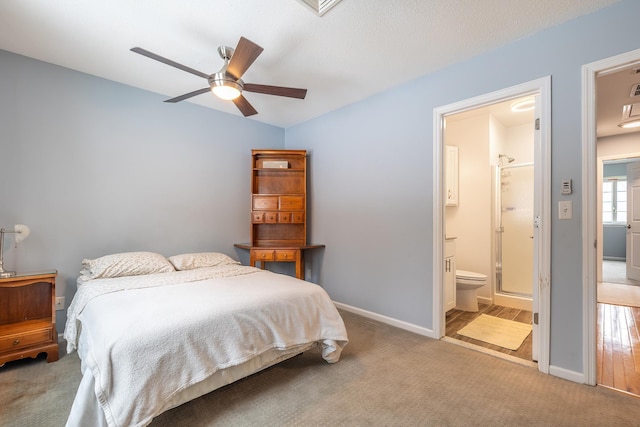 carpeted bedroom featuring ceiling fan and connected bathroom