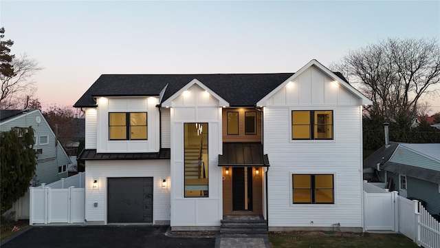 modern farmhouse featuring a garage