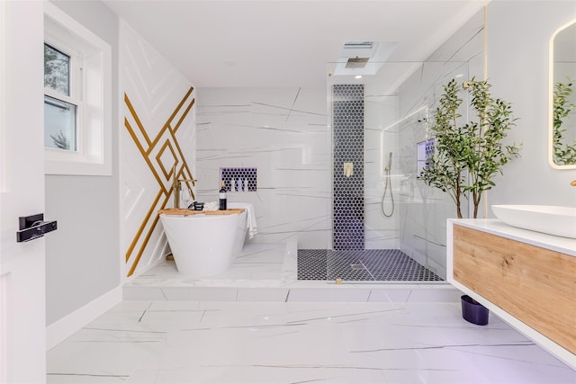 bathroom featuring vanity and shower with separate bathtub