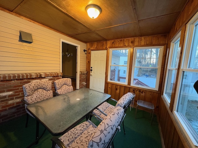 sunroom / solarium featuring wood ceiling