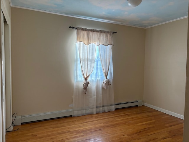 unfurnished room with light wood-type flooring, a baseboard heating unit, baseboards, and ornamental molding