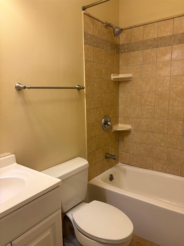 bathroom featuring toilet, shower / bath combination, and vanity