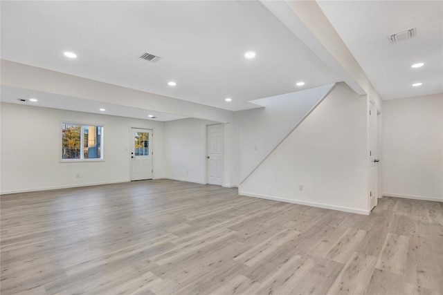 unfurnished living room featuring light wood-type flooring