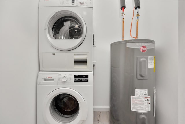 laundry room featuring hardwood / wood-style flooring, stacked washer and clothes dryer, and electric water heater