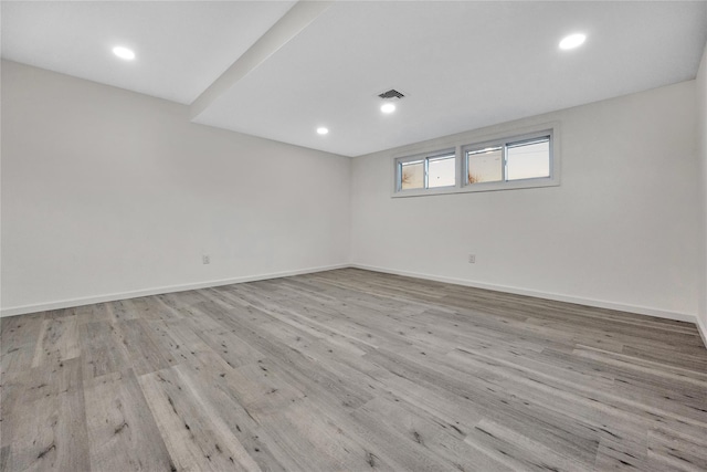 spare room with light wood-type flooring