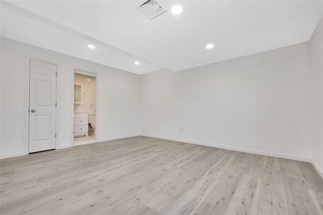 unfurnished room featuring light wood-type flooring