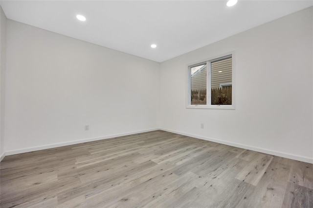 empty room with light wood-type flooring