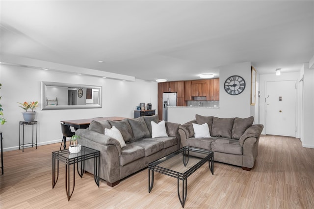 living room with light hardwood / wood-style flooring