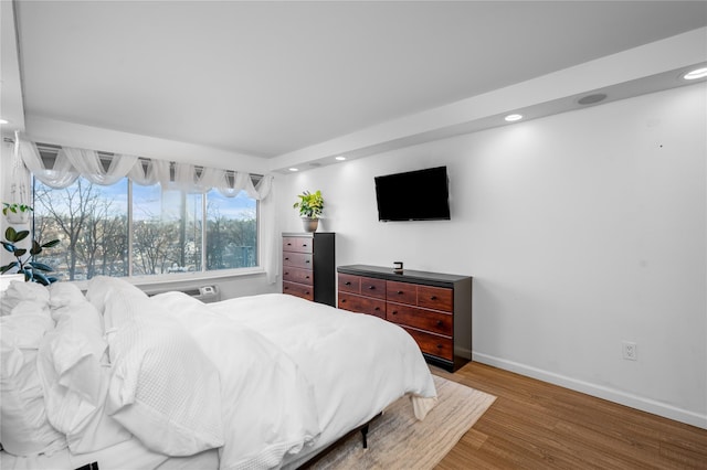 bedroom featuring wood-type flooring