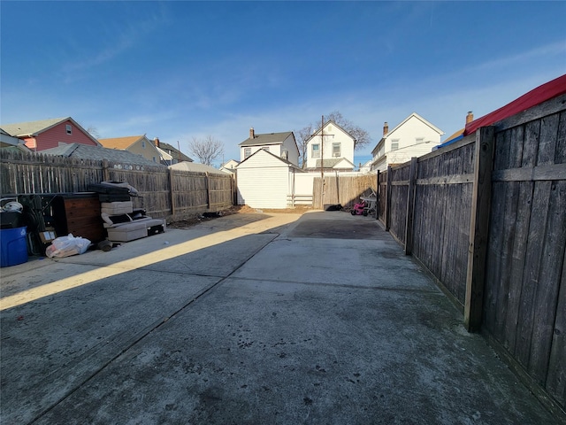 exterior space featuring a patio and a storage shed