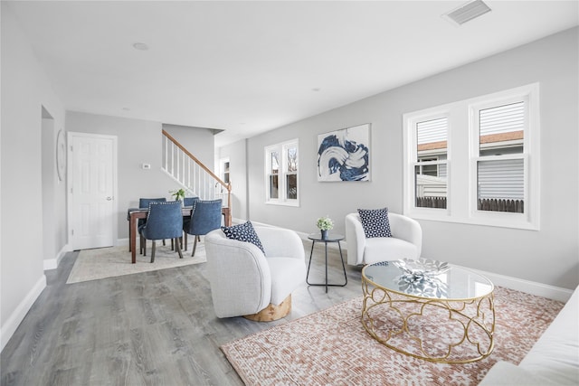 living room featuring a wealth of natural light and light wood-type flooring