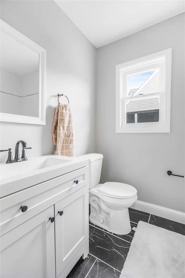 bathroom featuring vanity and toilet