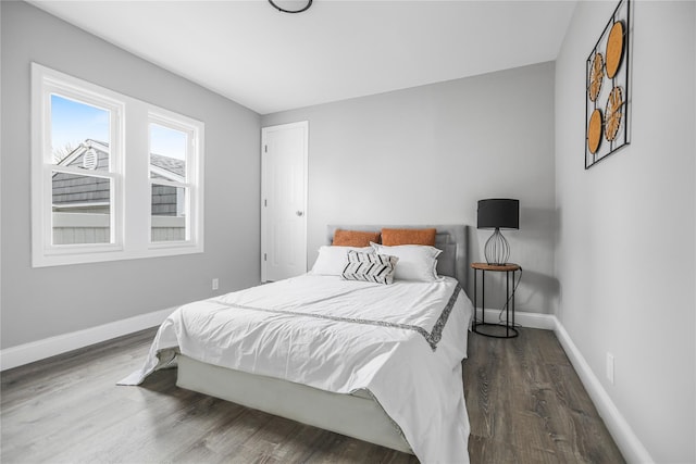 bedroom featuring dark hardwood / wood-style floors