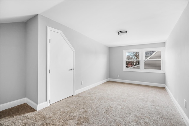 additional living space featuring carpet flooring