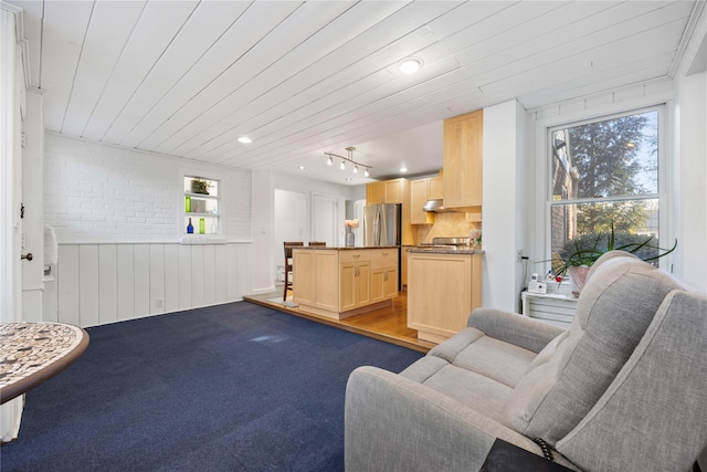 carpeted living room featuring wood ceiling