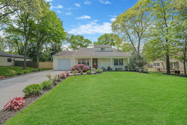 view of front facade featuring a garage and a front lawn