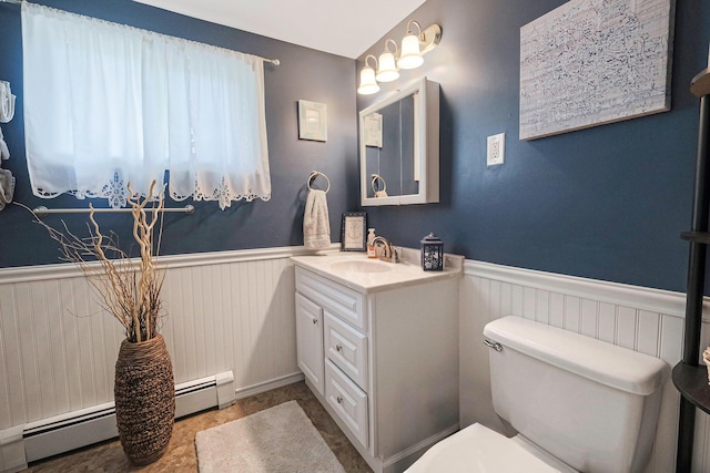 bathroom featuring vanity, a baseboard radiator, and toilet