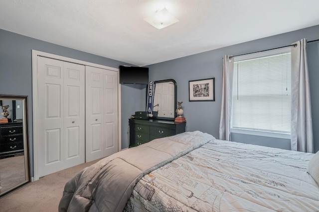 carpeted bedroom with a closet