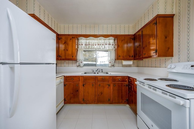 kitchen featuring sink and white appliances