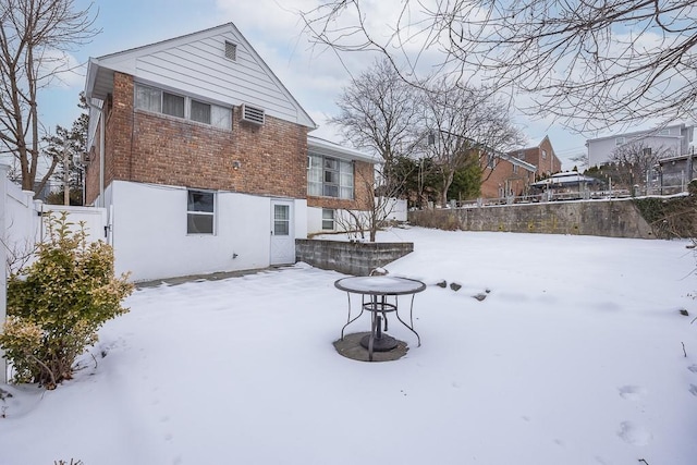 view of snow covered house