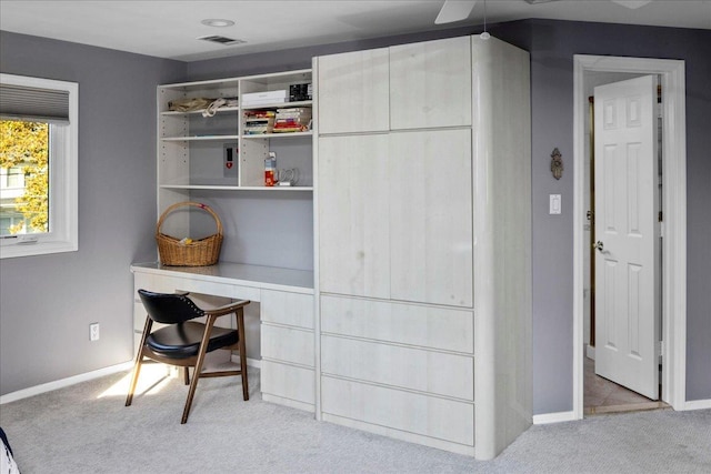 office space with light colored carpet