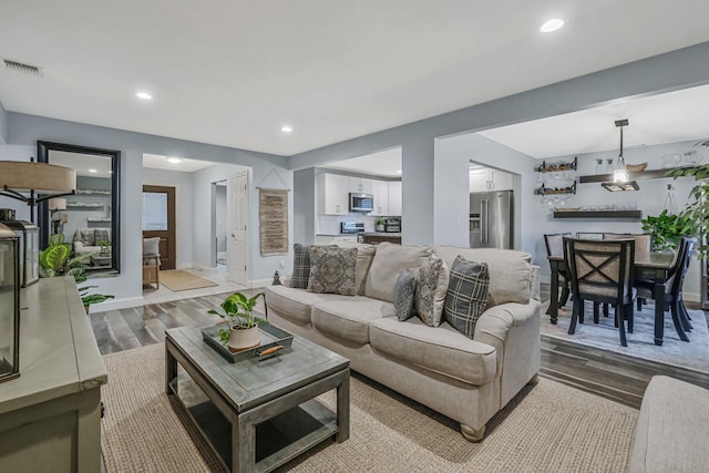 living room with light hardwood / wood-style floors