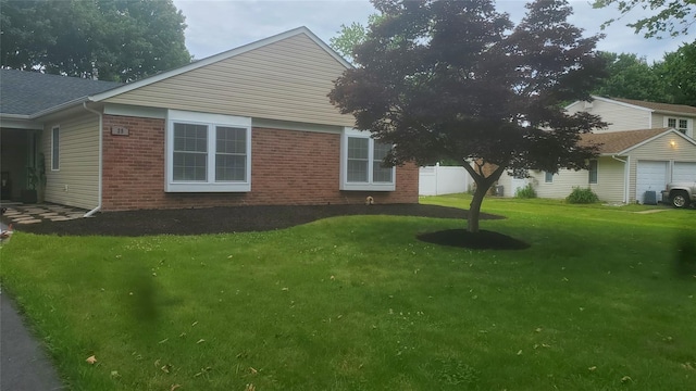 view of property exterior featuring a yard