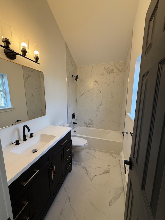 full bathroom with vanity, toilet, and tiled shower / bath