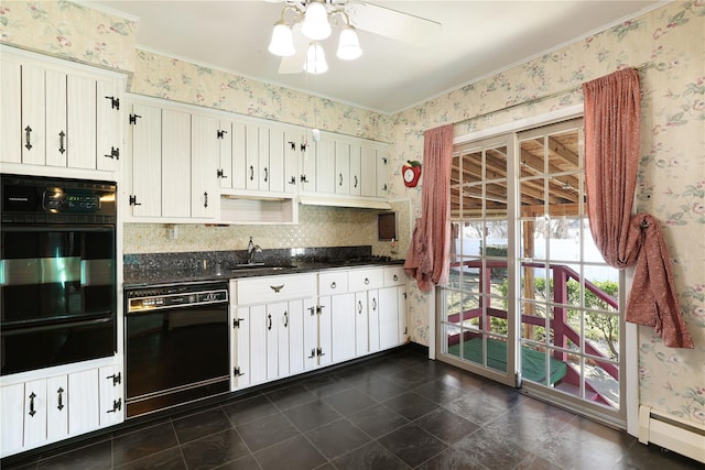 kitchen with baseboard heating, white cabinets, sink, and black appliances