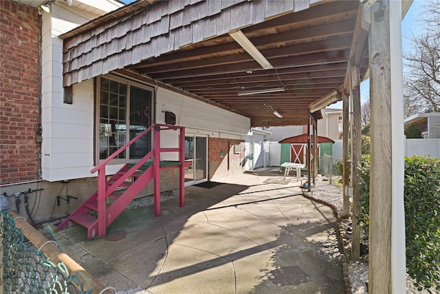 view of patio / terrace with a storage unit