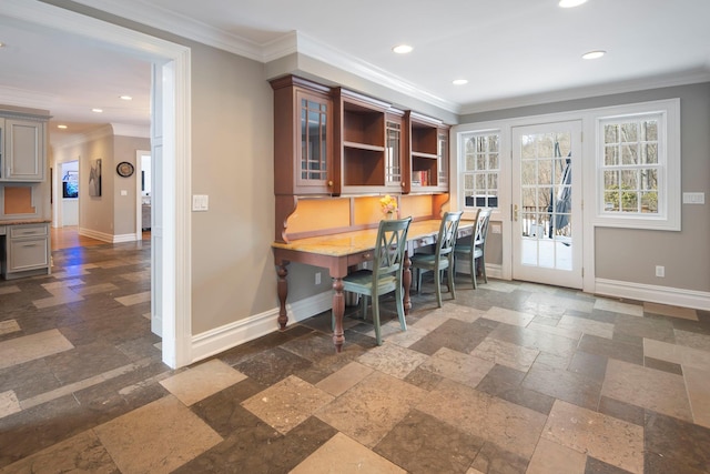 dining space featuring recessed lighting, stone tile floors, baseboards, and ornamental molding