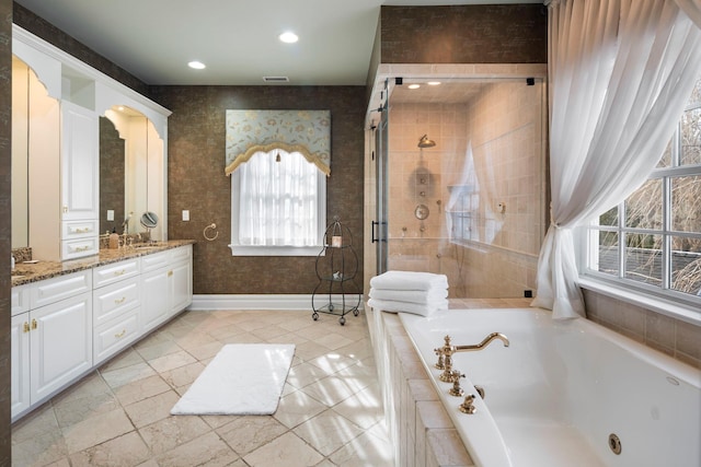 full bathroom featuring visible vents, baseboards, vanity, a shower stall, and a bath