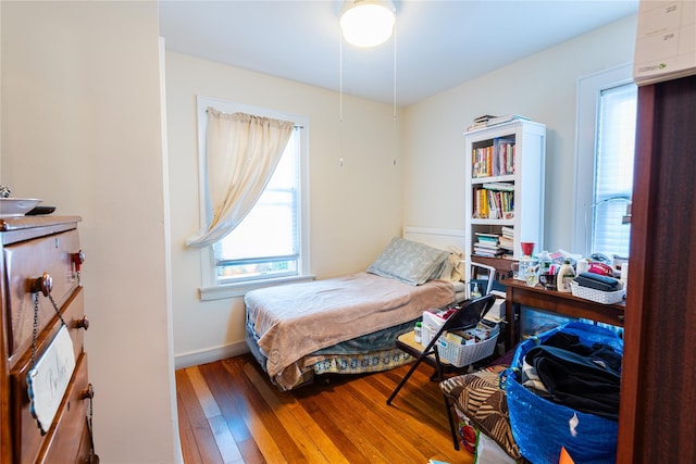 bedroom with hardwood / wood-style floors