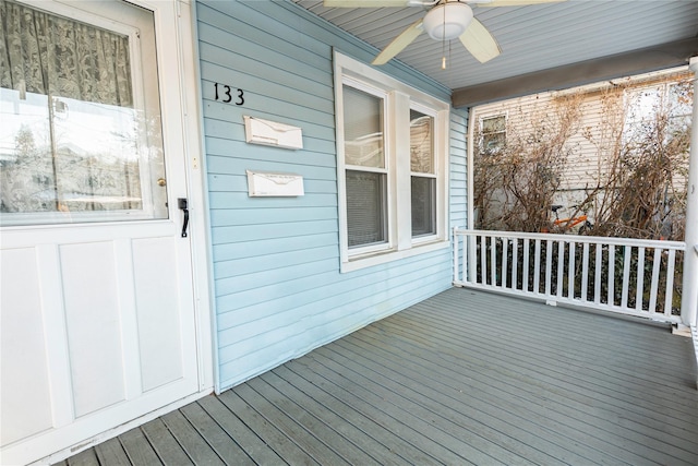 wooden terrace with ceiling fan