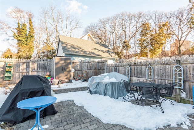 exterior space featuring area for grilling and a storage shed