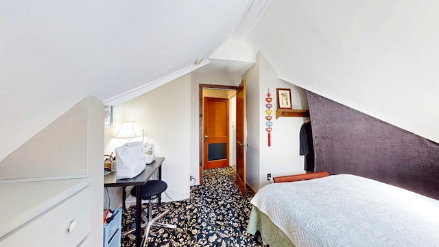 carpeted bedroom featuring lofted ceiling