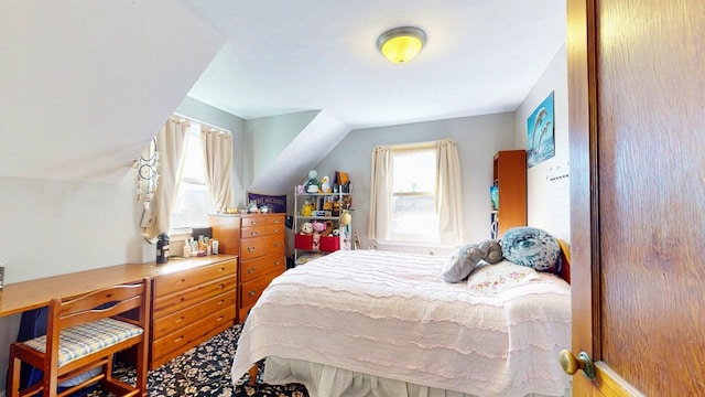 bedroom featuring lofted ceiling