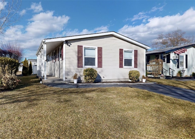 view of property exterior with a lawn