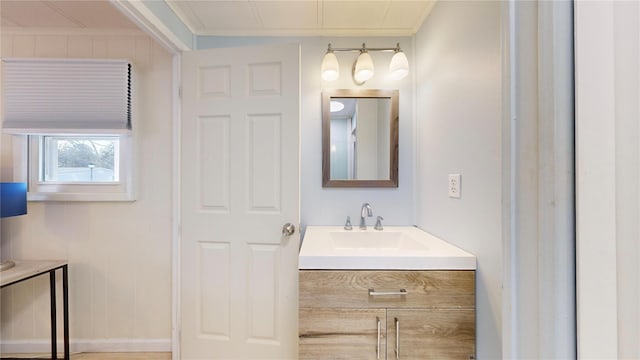 bathroom with vanity and crown molding