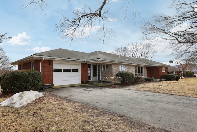 ranch-style house featuring a garage