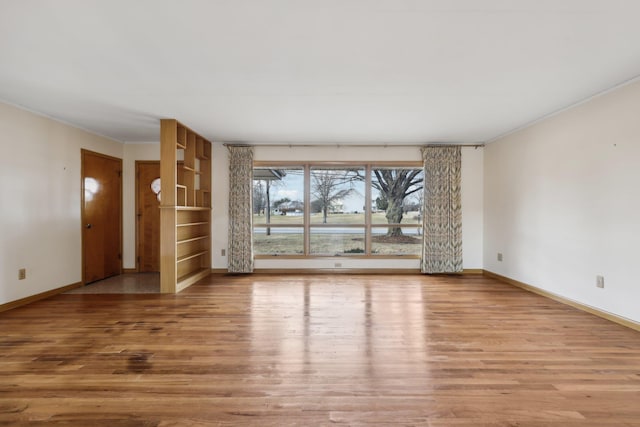 spare room featuring hardwood / wood-style floors